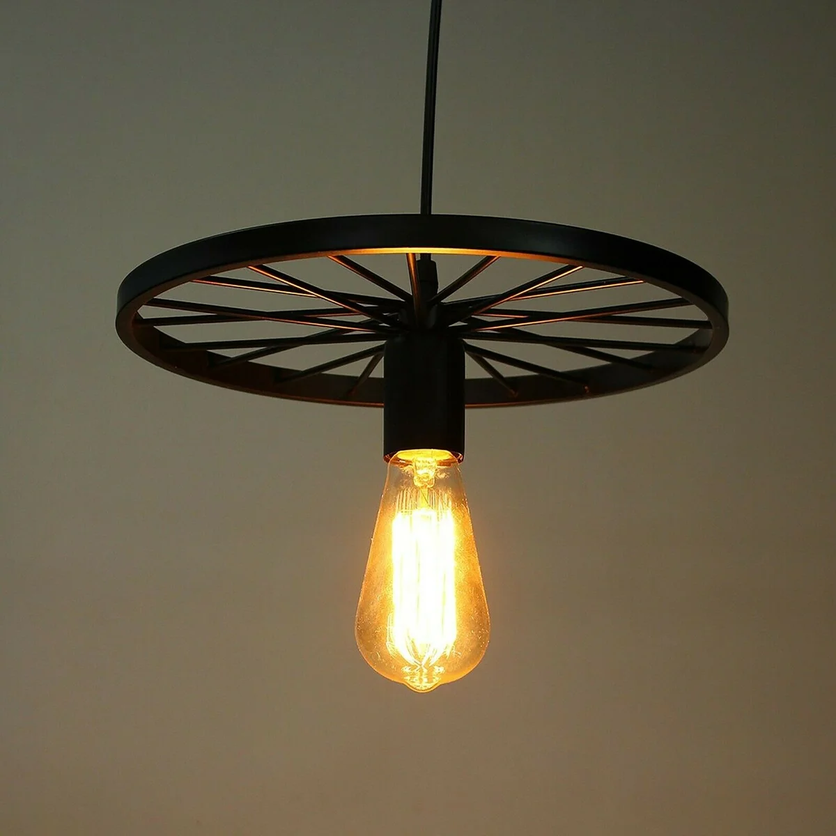 Brushed brass adjustable hanging lamp shaped like a retro wheel pendant with E27 bulb, ideal for industrial style spaces