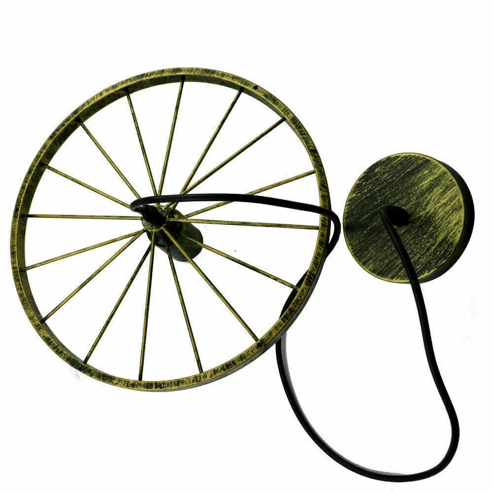 Brushed brass retro pendant light with wheel design hanging from ceiling, suitable for kitchen or bar lighting