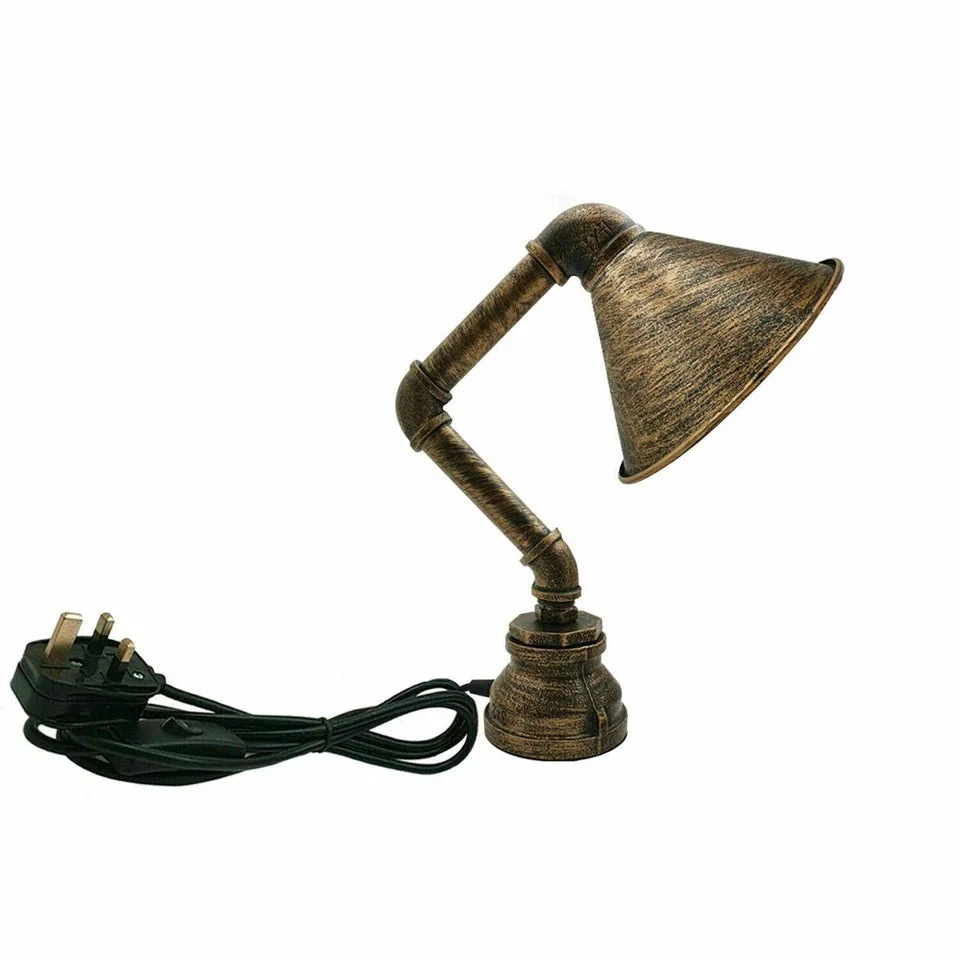 Retro steampunk water pipe plug in table lamp with metal cone shade in brushed copper finish on wooden surface