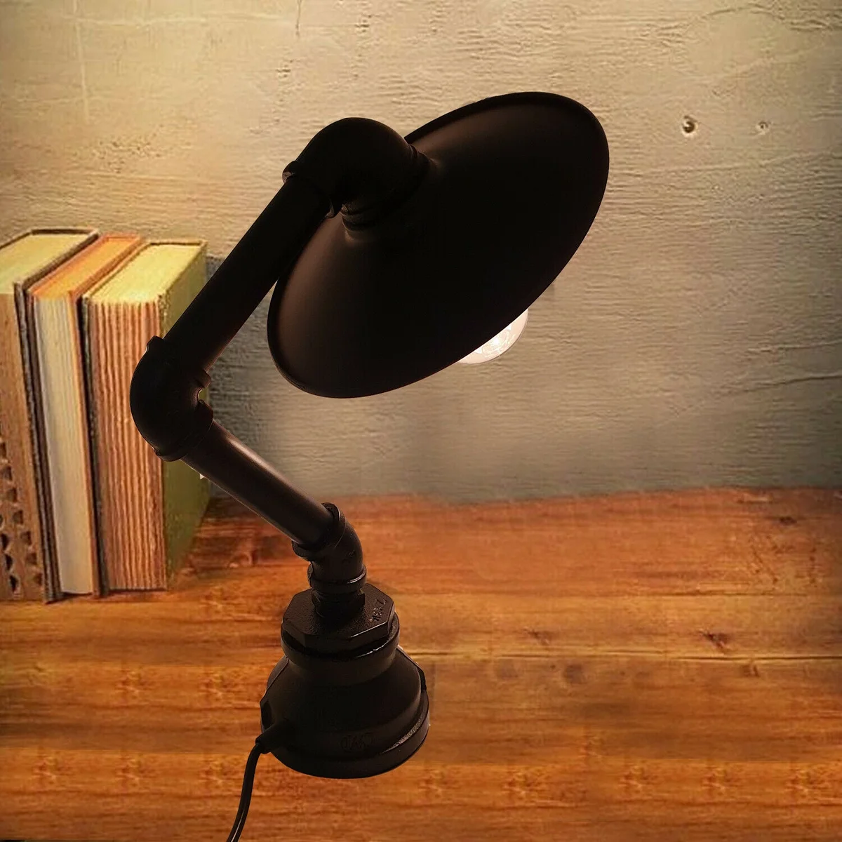 Vintage steampunk desk lamp with metal water pipe design, flat shade, and rust-resistant finish on wooden surface