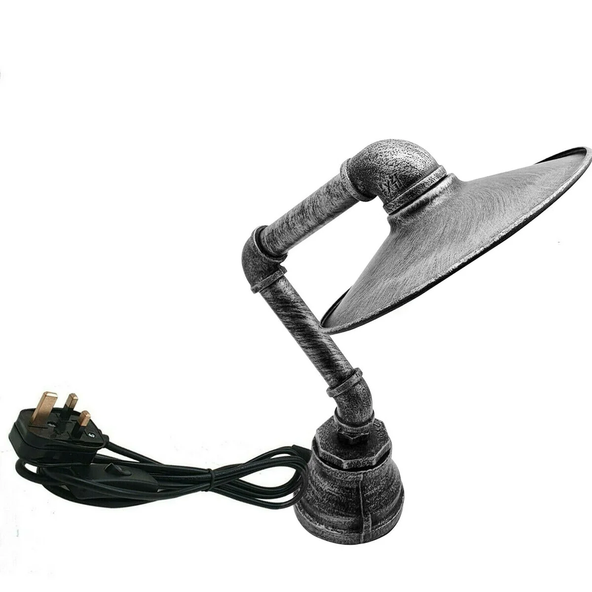 Vintage industrial desk lamp with water pipe design, flat metal shade, and inline switch on black cord on wooden desk surface