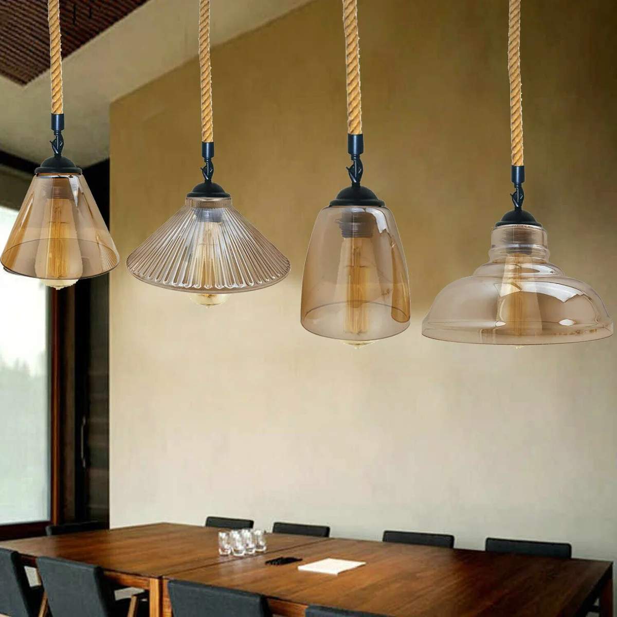 Vintage industrial glass lampshade pendant with hemp rope and iron metal hanging fixture in rustic nautical style