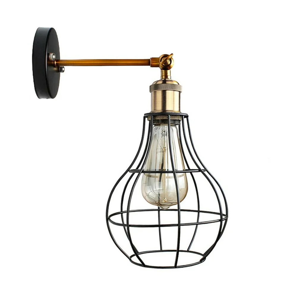 Metal vintage wall light fixture with cage shade and vintage bulb, mounted on white wall for UK interiors