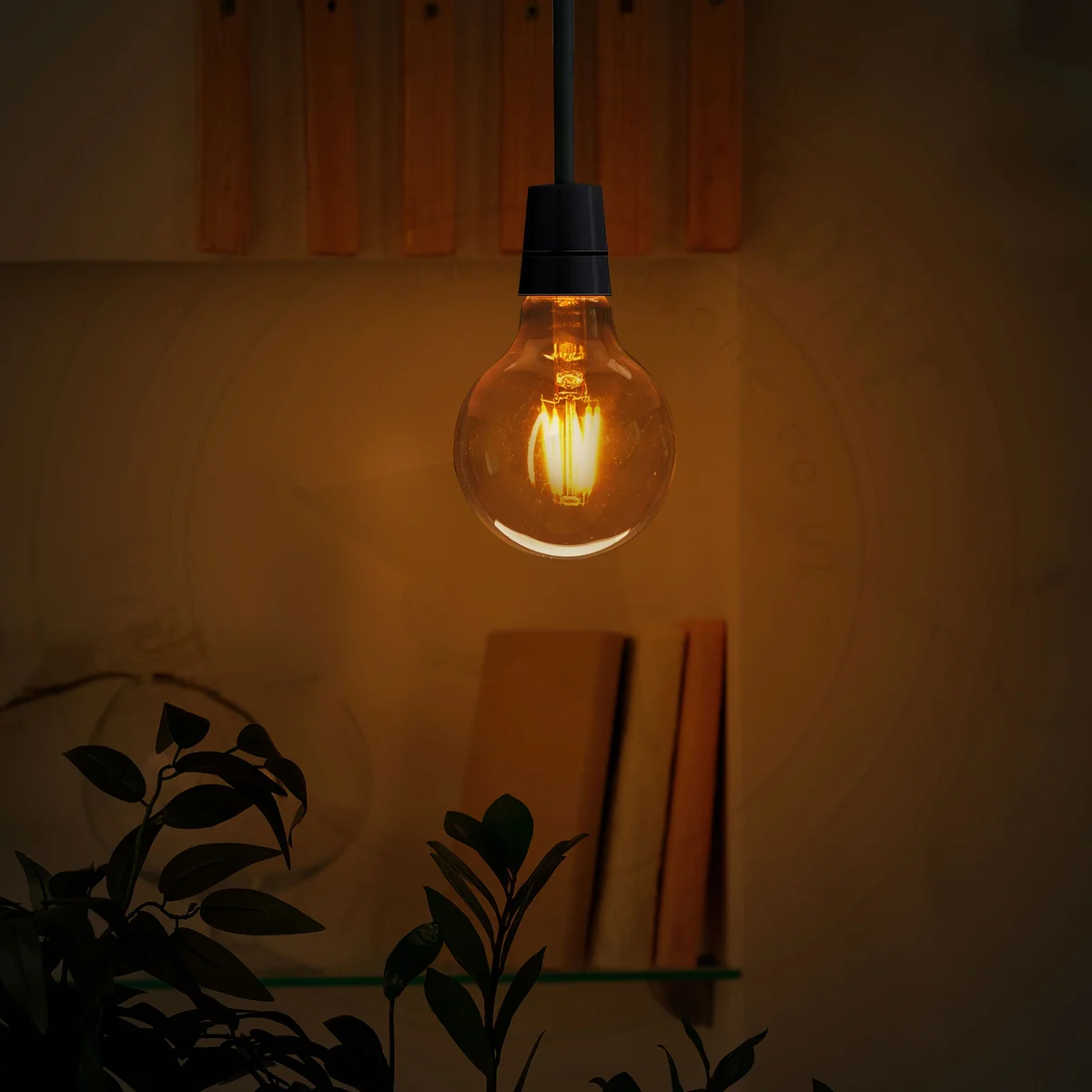 Four amber glass G95 E27 LED filament bulbs with warm white light and E27 screw bases displayed on a white surface