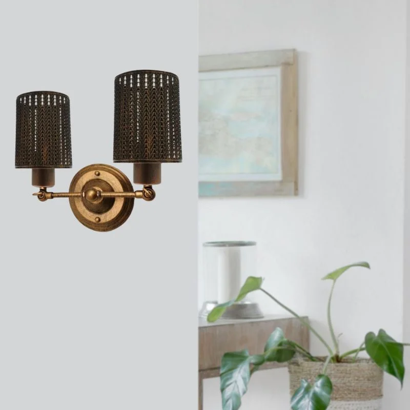 Brass wall light mounted on wall, brushed copper finish, iron body, single E27 base, no bulb included.
