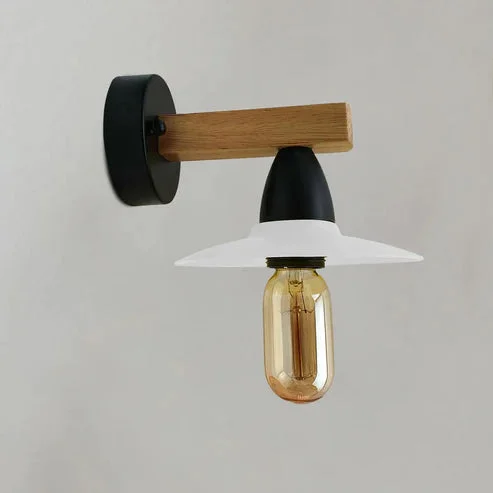 Three modern wall lights with filament bulbs, PVC shades, and natural wood accents mounted on a white wall