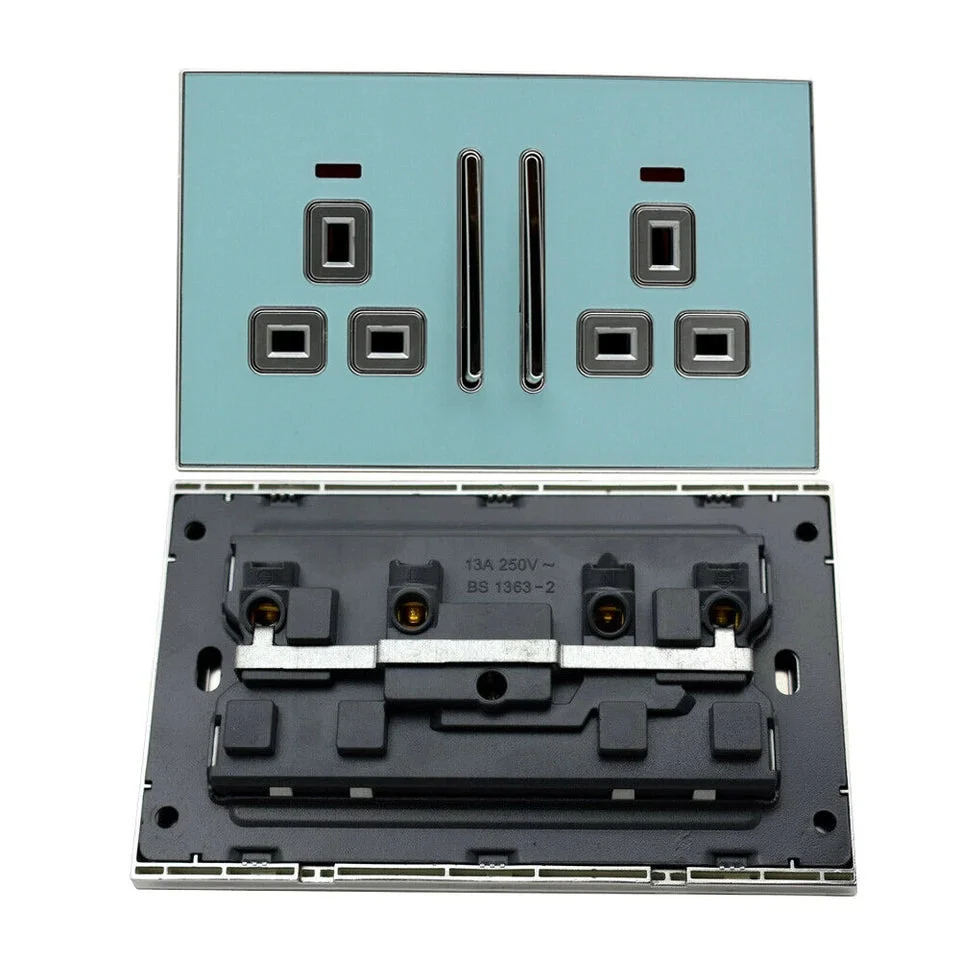 Blue glossy 13 amp wall outlet with satin gold insert, screwless design, square shape on white background