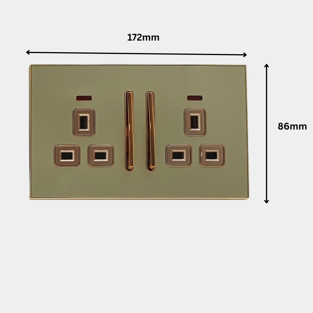Decorative gold glossy one gang UK plug socket with satin gold inserts and screwless design on white background
