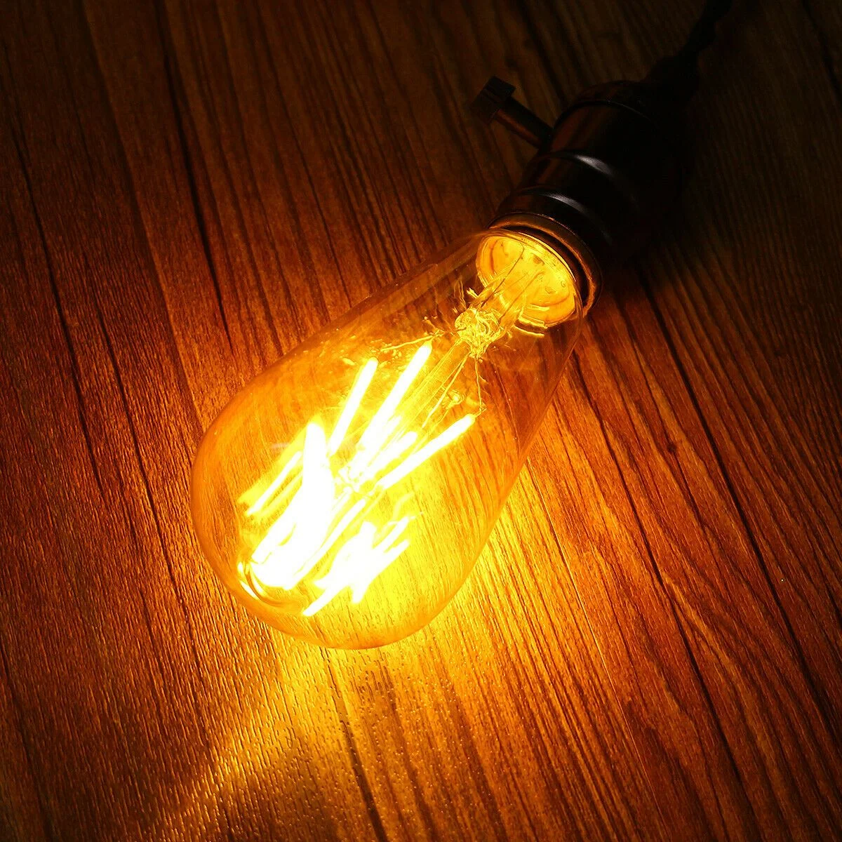 Six vintage LED filament bulbs with clear glass and visible filaments, E27 base, warm white light, arranged on white background