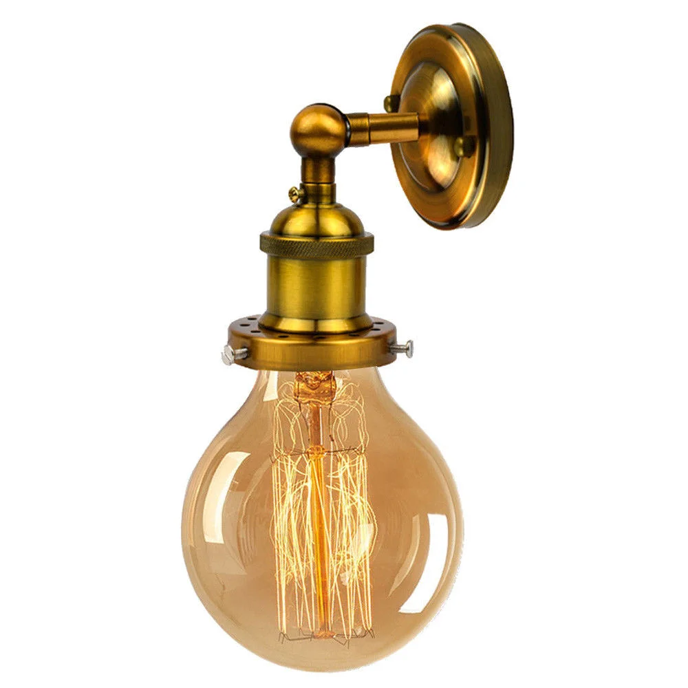 Vintage industrial wall light with yellow brass finish, round ceiling rose, and E27 Edison lamp holder mounted on wall