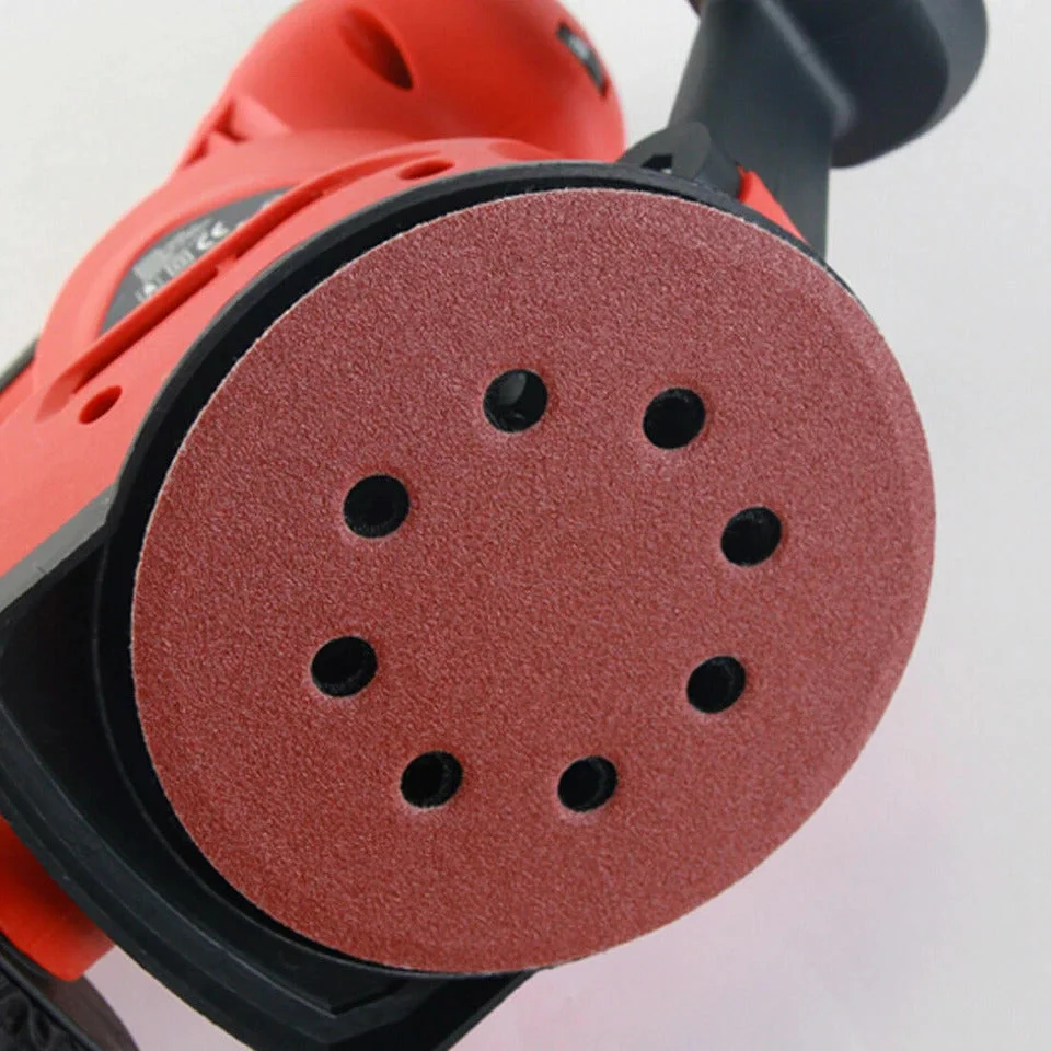 Set of reddish-brown 125mm sanding discs with 8 holes and hook and loop backing for dust extraction and easy attachment