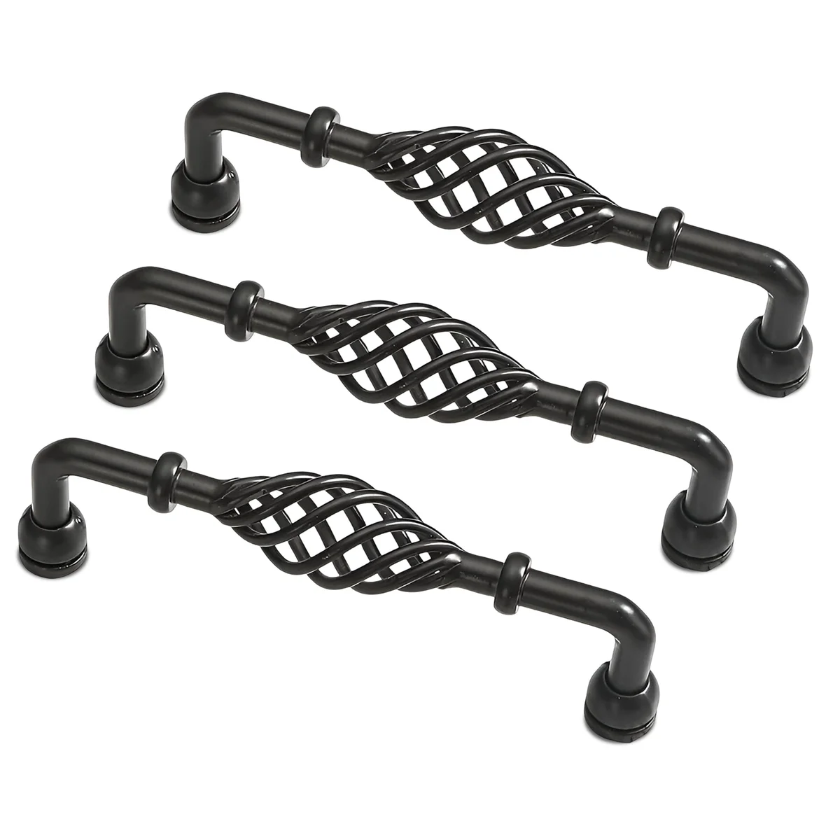 Black vintage kitchen cabinet handle in birdcage design mounted on wood drawer front with screws visible