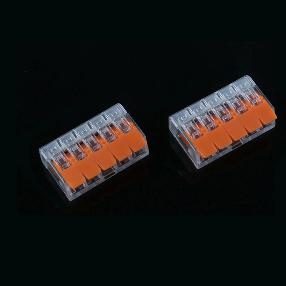 Clear and orange 32A 5 way wire connectors with spring lever push fit design for secure electrical connections