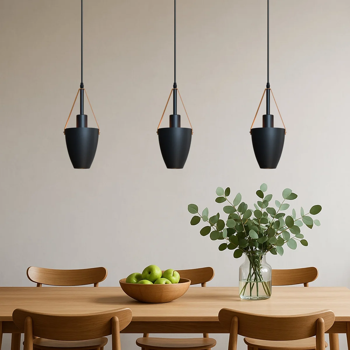 Matte black metal industrial pendant light with brown leather strap hanging from adjustable cable against white background