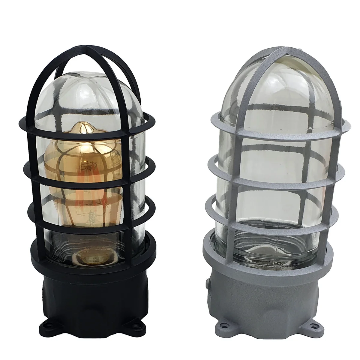 Coastal wall lamp with black metal bulkhead and clear glass shade, nautical vintage look.