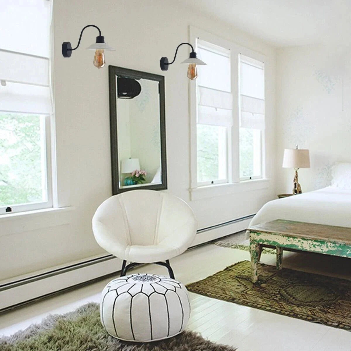 Vintage wall light with curved gooseneck arm, white ceramic shade, and exposed hardware in industrial style