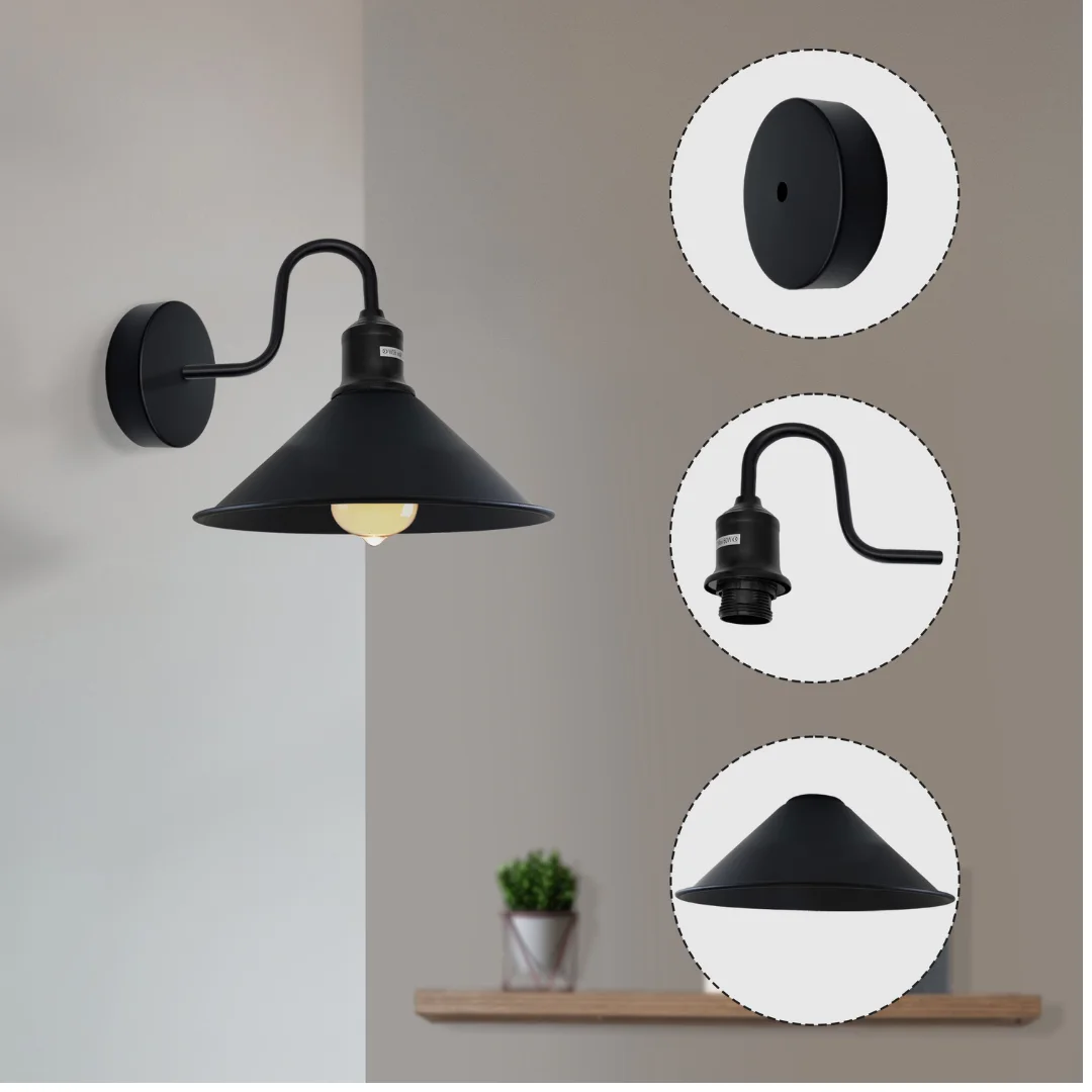 Black industrial cone shade wall light with swan neck arm mounted on a white indoor wall
