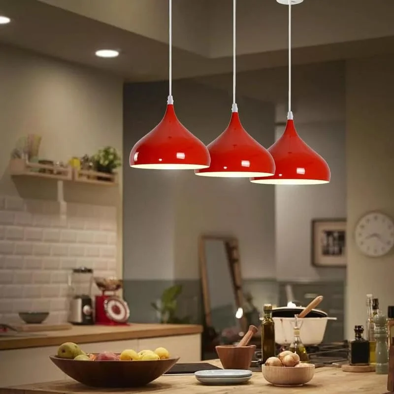 Red industrial nautical barn pendant light with adjustable cable pendant and vintage Edison bulb hanging from ceiling