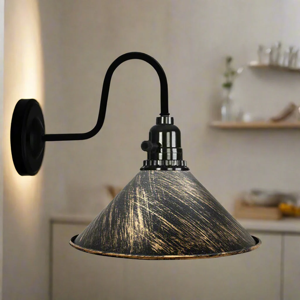Copper wall light with vintage metal shade and attached on/off switch mounted on round base against white background