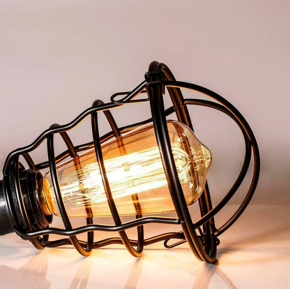 Industrial style iron cage pendant light with exposed bulb and 95cm cable hanging from ceiling rose in rustic decor setting