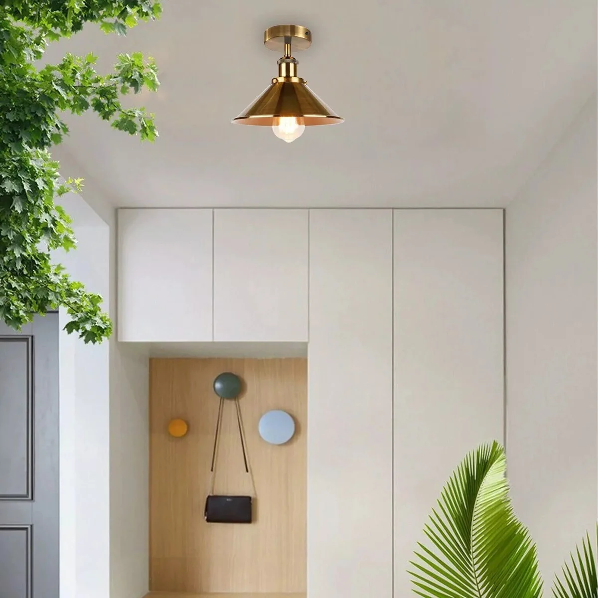 Vintage yellow brass cone pendant adjustable height ceiling light with warm white glow, hardwired for indoor use