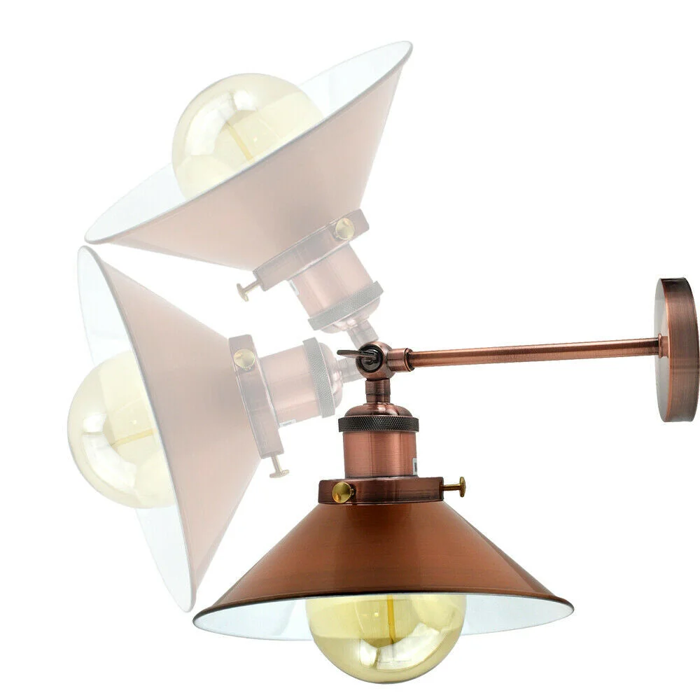 Adjustable vintage brass wall sconce with cone metal shade mounted on a wall, showing antique industrial design and warm finish