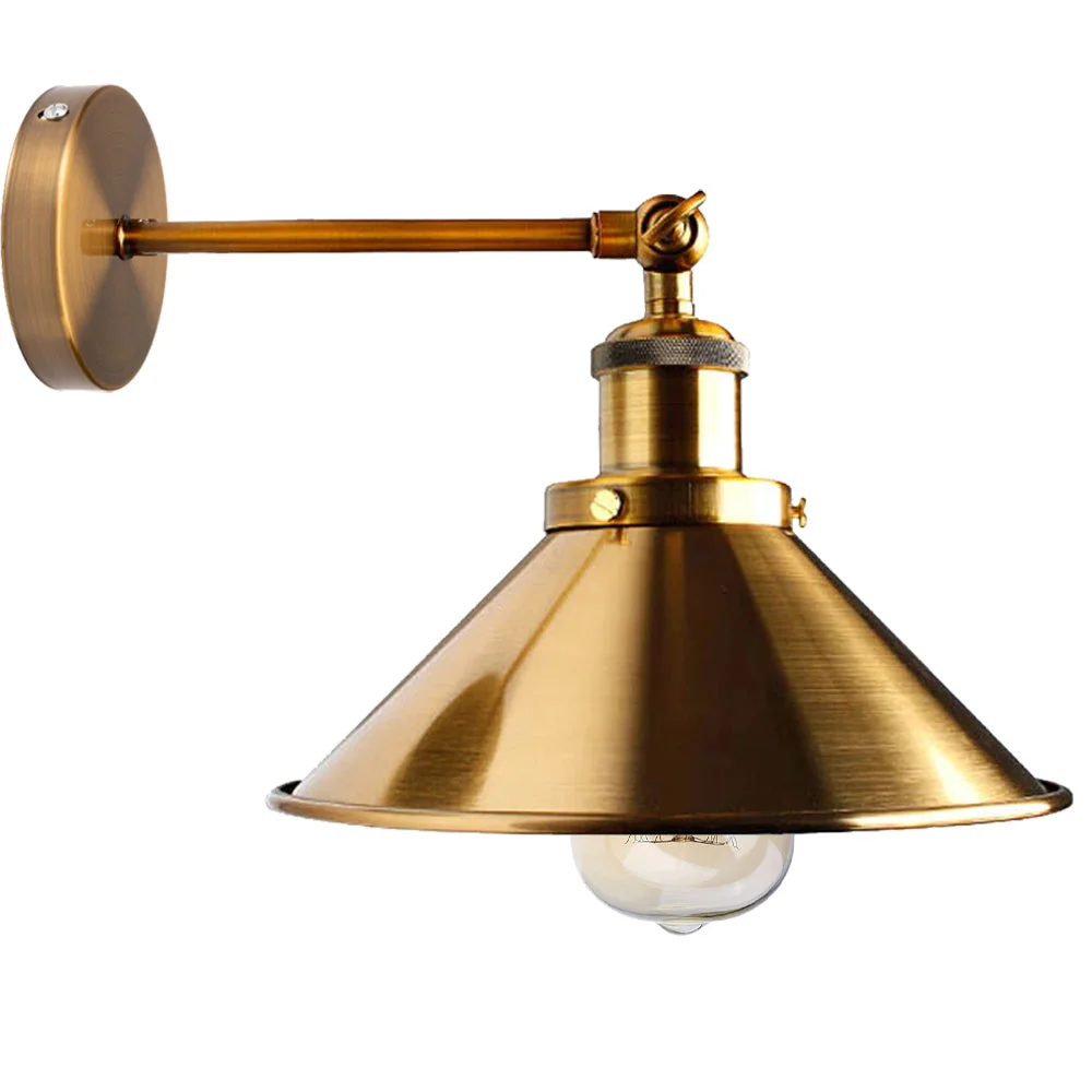 Adjustable industrial E27 wall light fitting in antique brass with metal cone shade mounted on a white wall