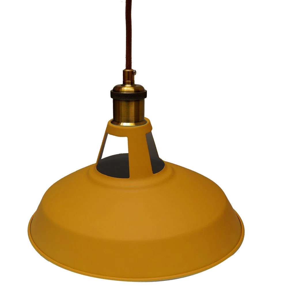 Yellow metal lampshade ceiling light with black fabric cord hanging against a white background, vintage industrial style