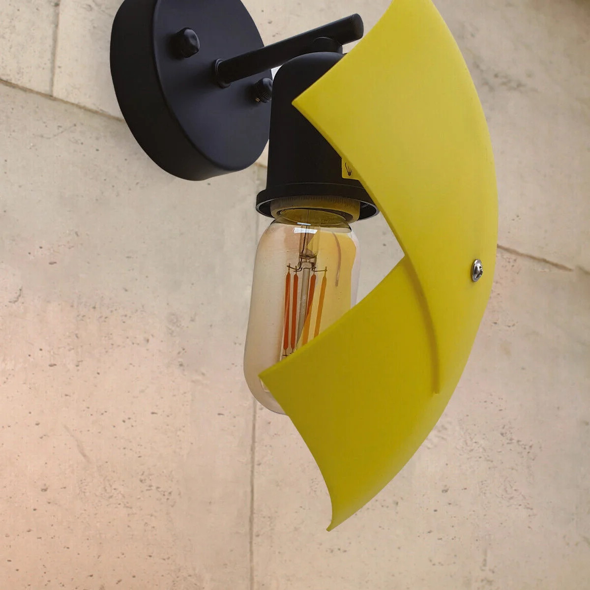 Black PVC lampshade light with exposed hardware and metal arm, modern industrial wall-mounted design with bulb included