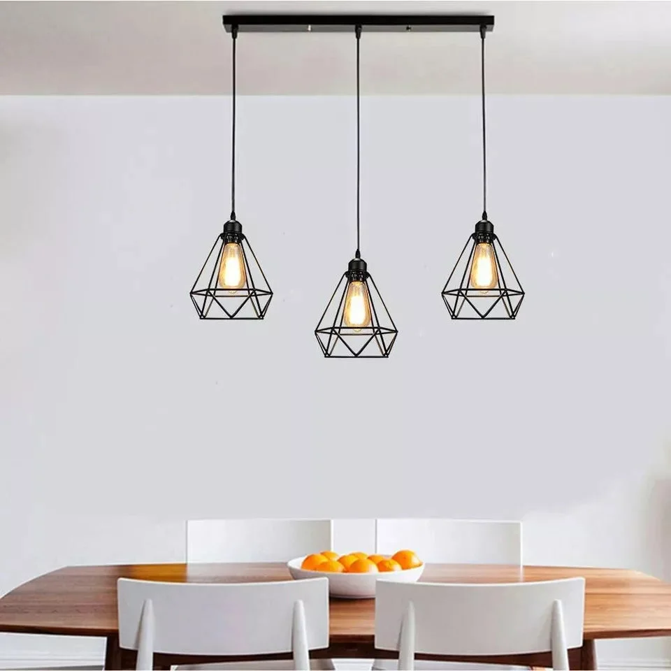 Retro Loft 3 head industrial pendant lamp with metal cage shades and exposed bulbs hanging from ceiling cord