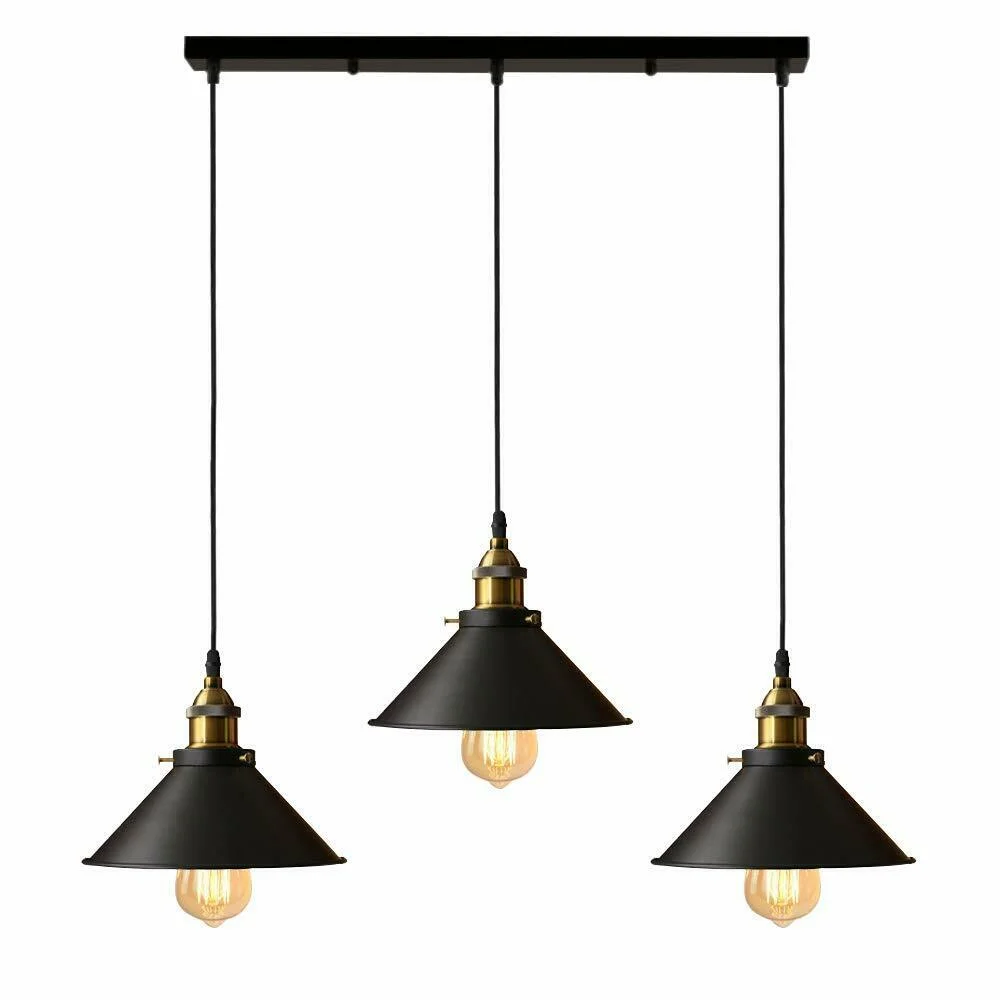 Adjustable ceiling pendant light with three black and white metal shades and twisted cable hanging from ceiling plate