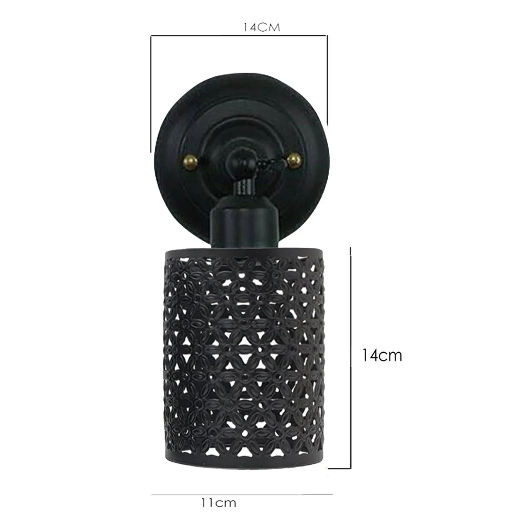 Rustic metal cage wall light with vintage industrial design and exposed bulb, perfect for indoor decor and lighting.