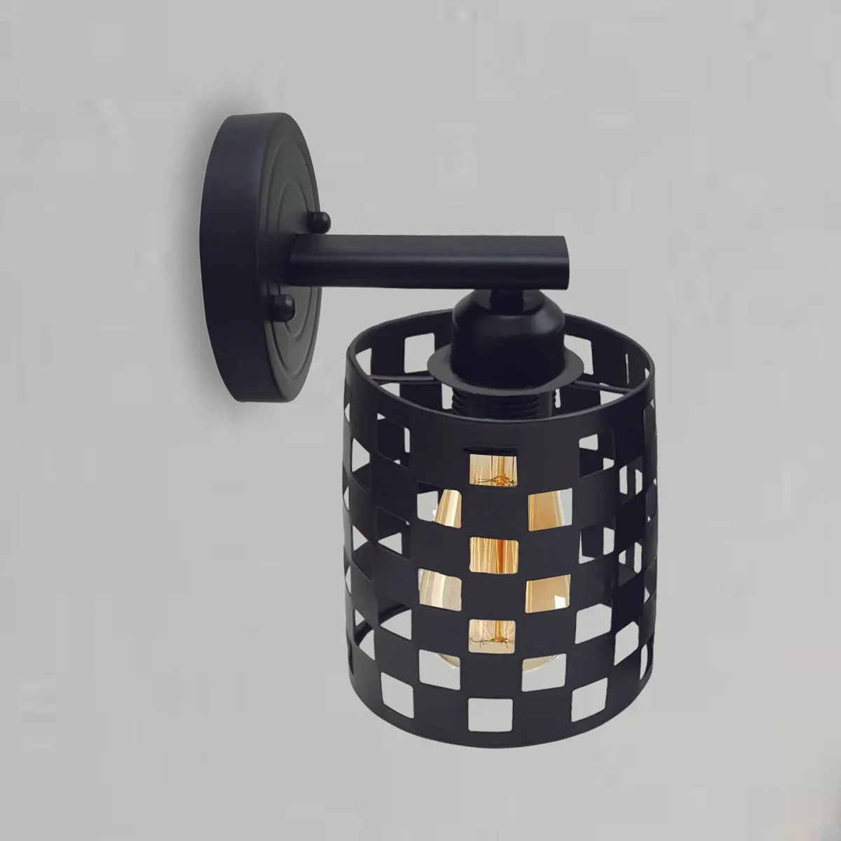 Metal industrial wall light with rustic wire cage and E27 bulb base, suitable for indoor use in various rooms