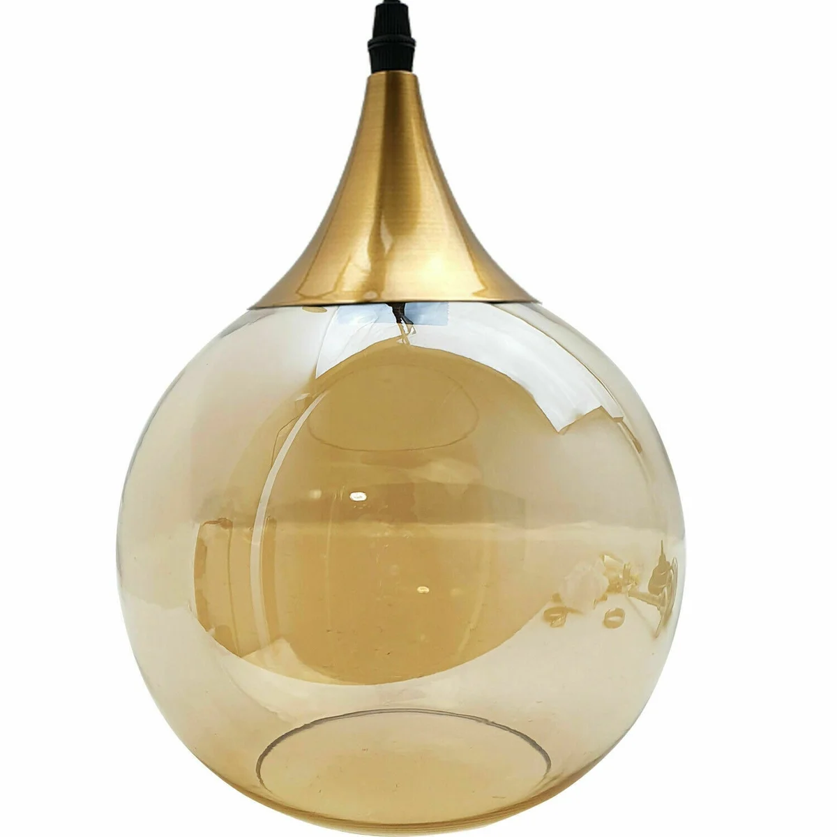 Smoked glass pendant light with amber hand-blown globe shade and exposed iron hardware hanging from adjustable cord