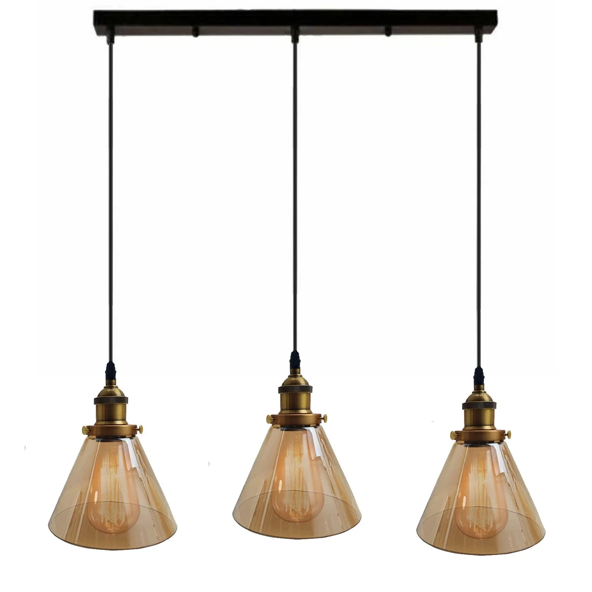 Cluster pendant lights with three amber glass shades, black adjustable cords, LED bulbs standing in modern study.