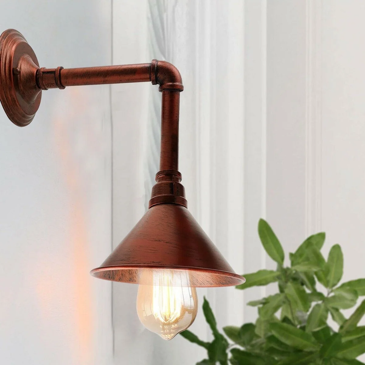 Indoor wall light, black metal pipe with cone shade, fitted with E27 bulb holder, wall mounted design.