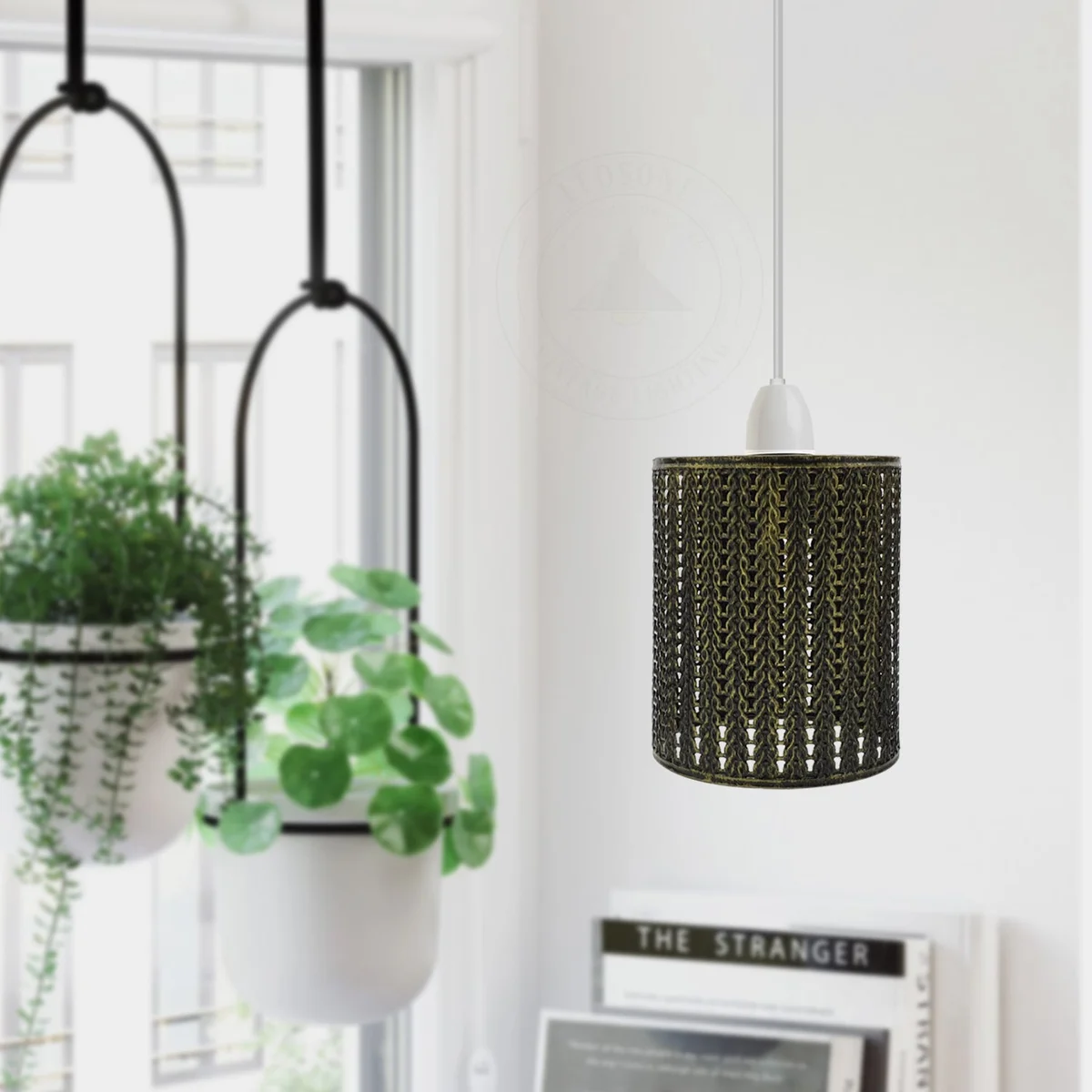 Industrial pendant lampshade with open metal wire cage, drum shape, brushed metal finish, hanging from ceiling
