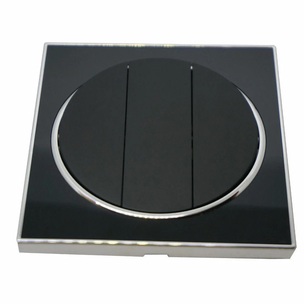 Black screwless wall light switch in a round flat plate design, featuring a 3 gang layout and a sleek, minimal look.