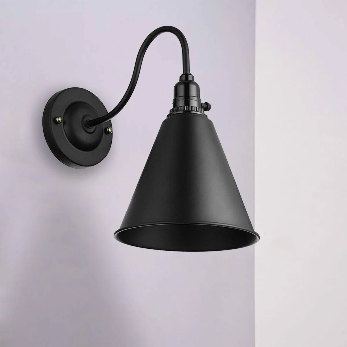 Industrial wall light with iron cage shade, rustic vintage style, metal wall-mounted sconce.