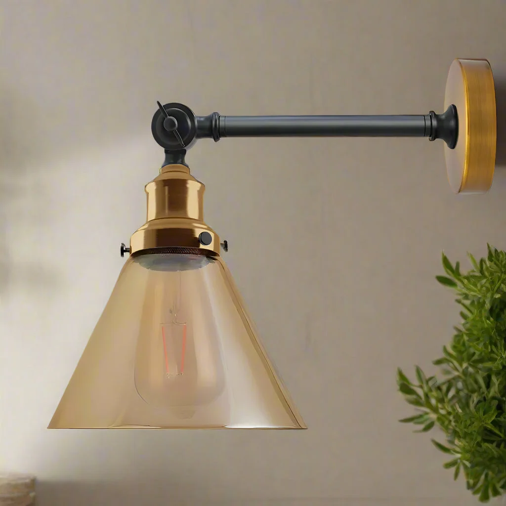 Vintage wall light with amber glass shade, gold‑toned copper‑plated base, adjustable design, modern industrial style