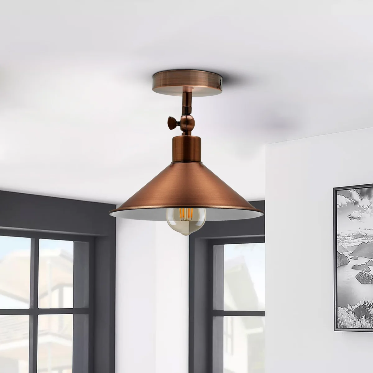 Industrial metal pendant light with a wide‑aperture copper shade hanging from a 10cm ceiling rose, suitable for E27 bulbs