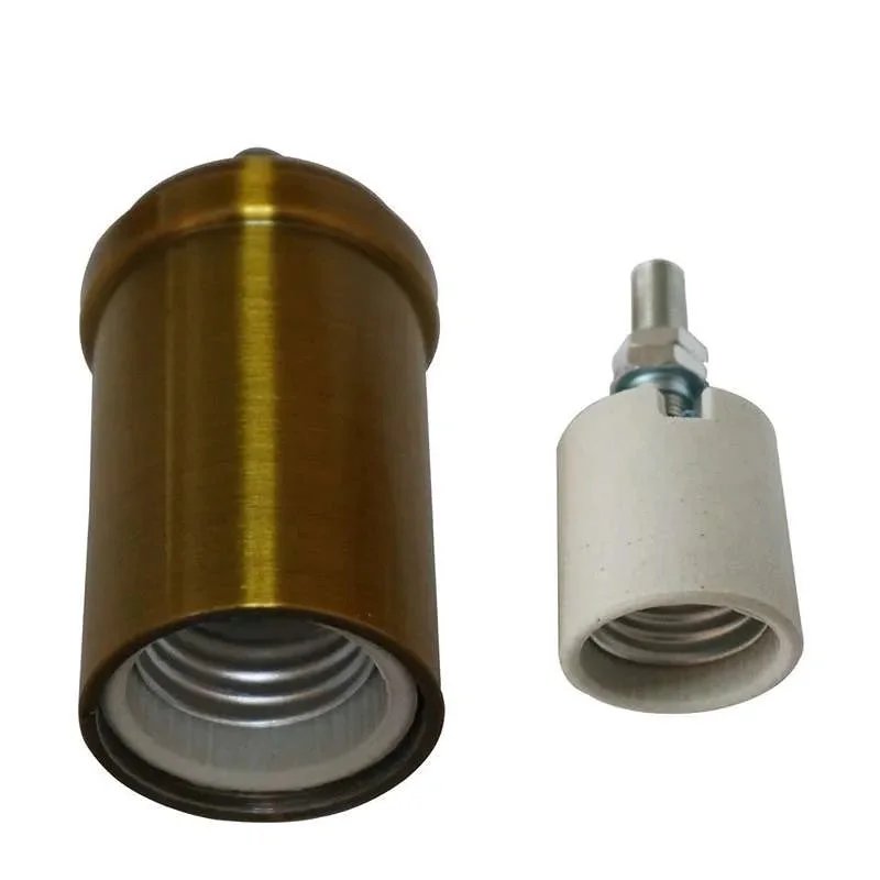 Rose gold metal E27 lamp holder on a wooden table, vintage style lamp holder, polished metal finish.