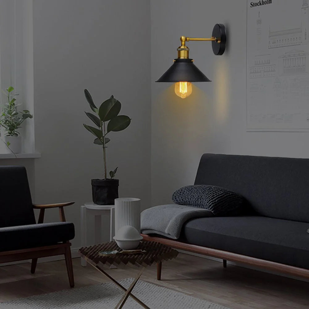 Black wall lights with sleek round shade and adjustable fabric cable, mounted on wall, showcasing luxury black finish.
