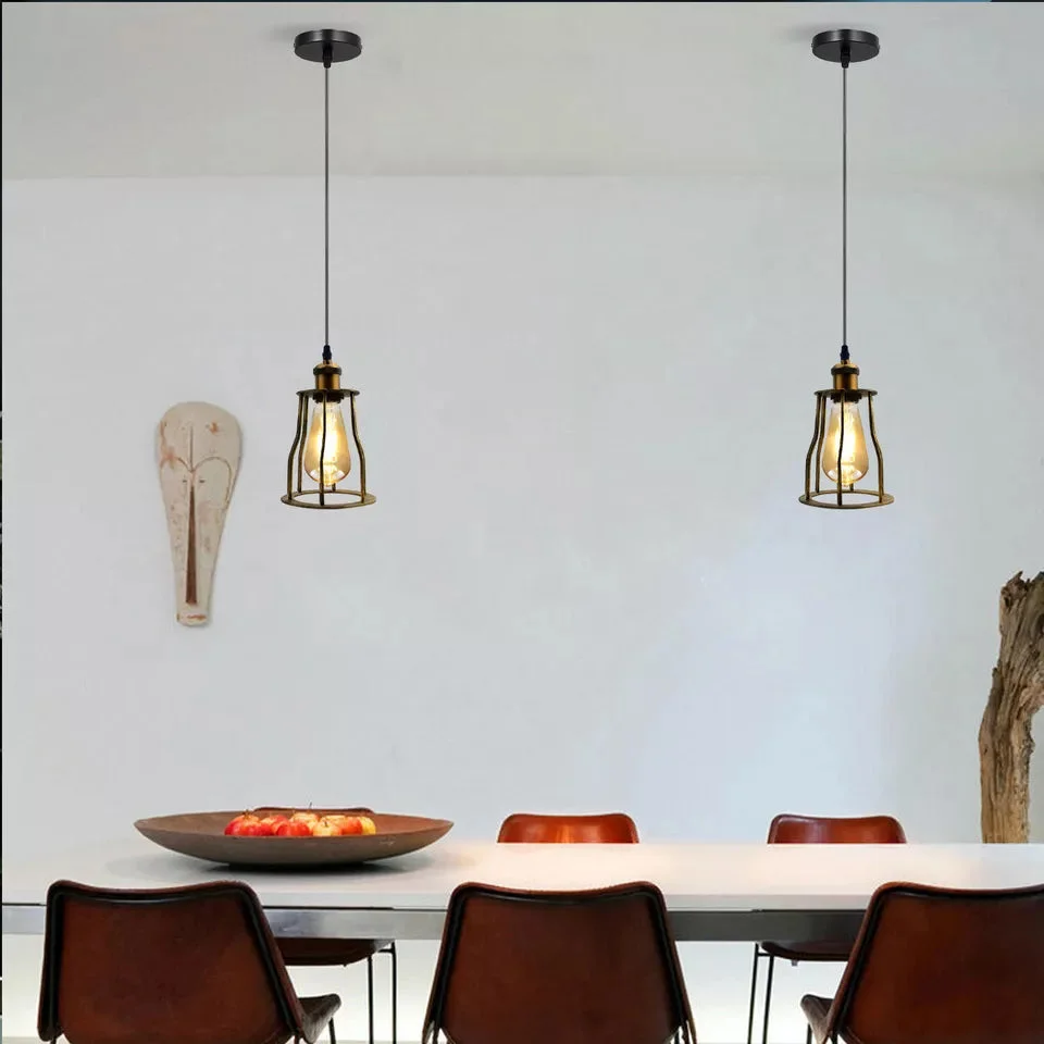 Industrial ceiling light: vintage brass pendant with round 14‑cm brass shade, black fabric‑wrapped cable, wire cage design