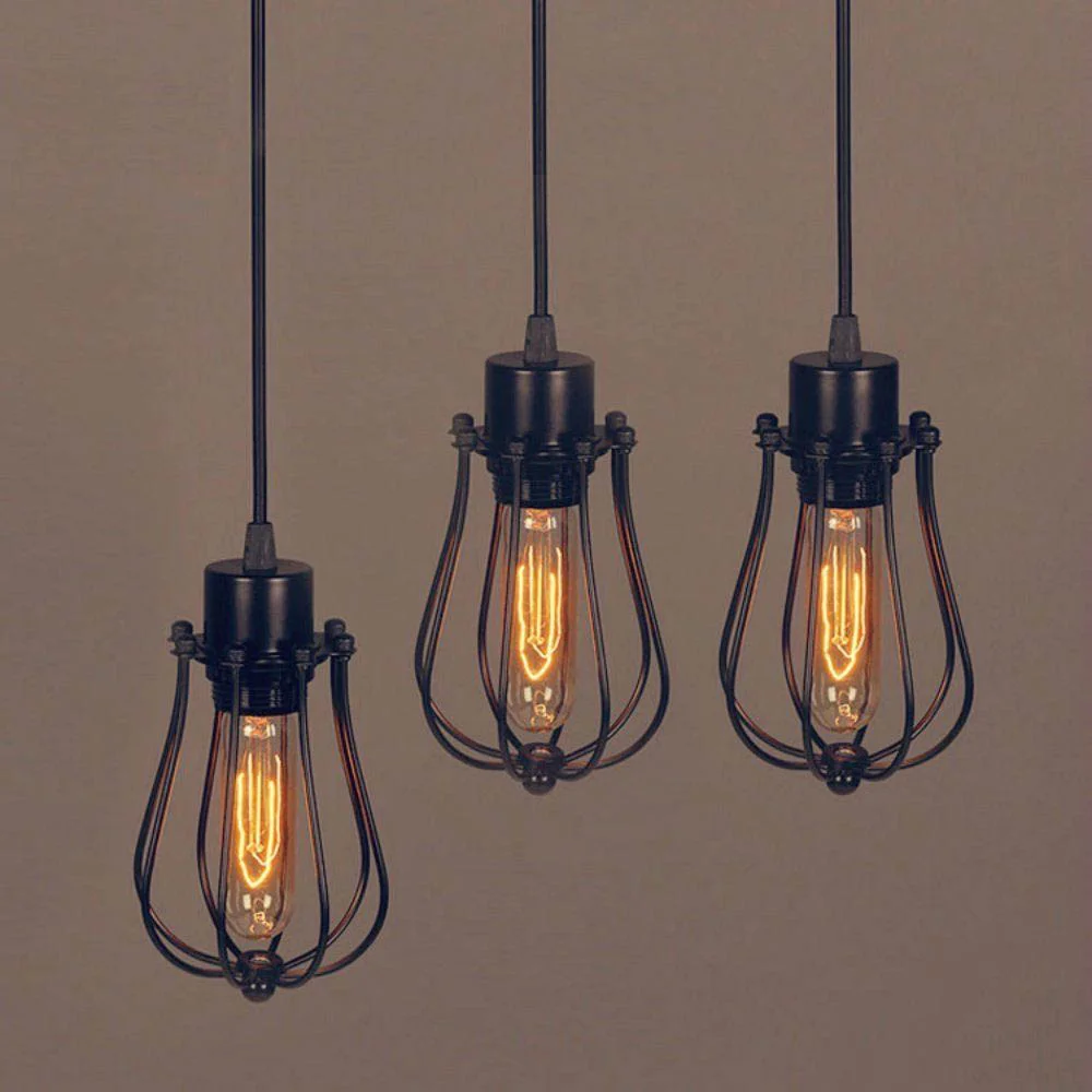 Vintage pendant light with black balloon shaped metal shade and round fabric cord, E27 socket, hanging from ceiling.