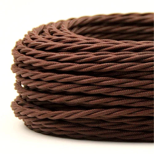 Twisted brown cloth‑covered 2‑core electrical cord with PVC insulation and braided copper cores, flexibly coiled.