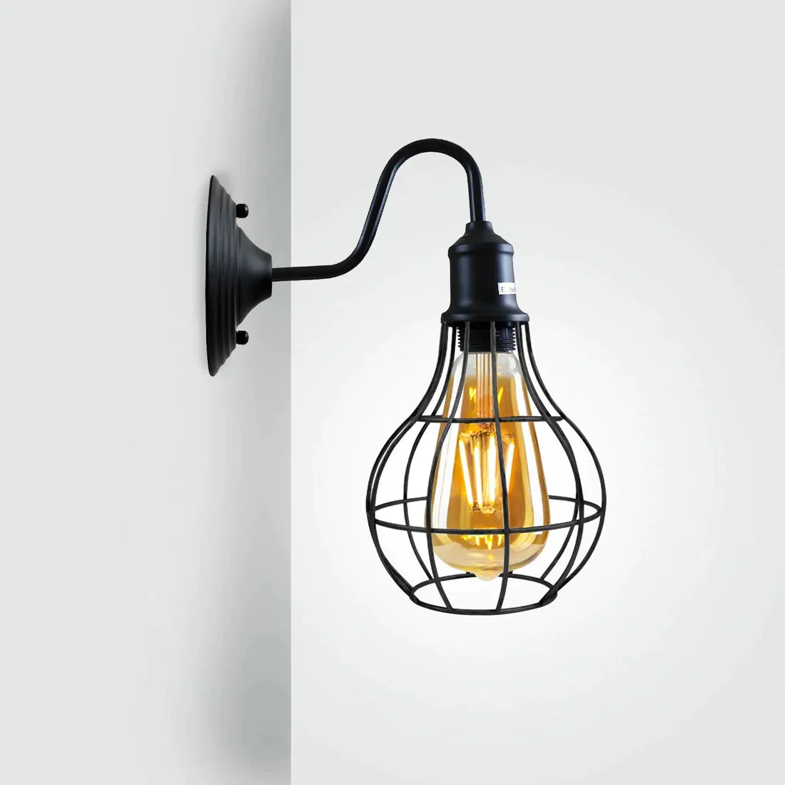 Industrial matte black wall lamp with iron cage, 240mm arm and E27 holder, showcasing vintage design.