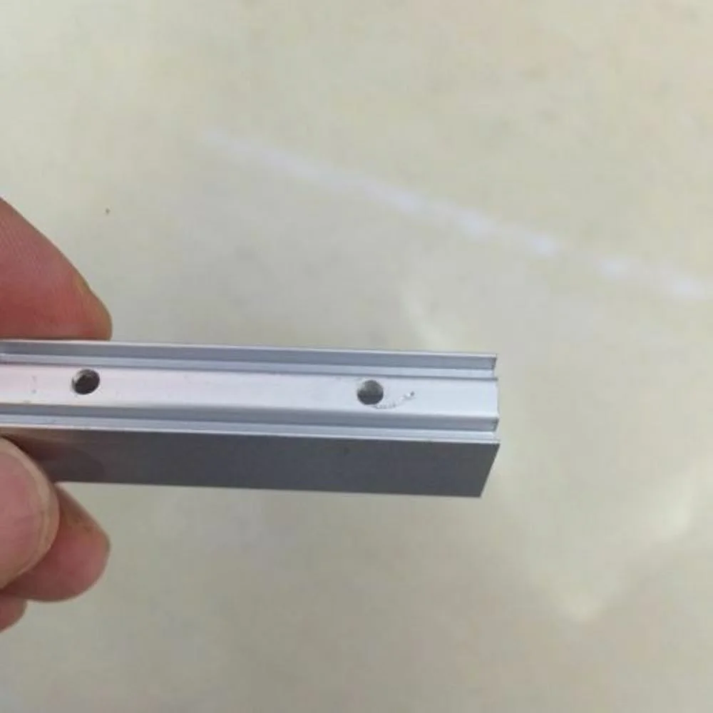 Neon light mounting clip, 8x16 mm metal fastener for LED neon flex, shown alone in close‑up with spring‑loaded clasp.