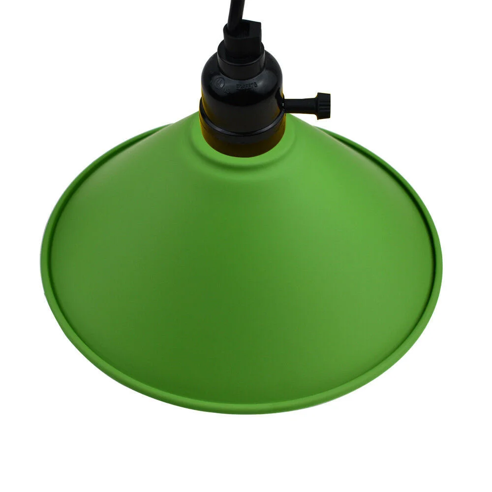 Green pendant ceiling light fixture with black fabric cable hanging from metal ceiling rose, 21 cm glass shade, 8.5 cm height.