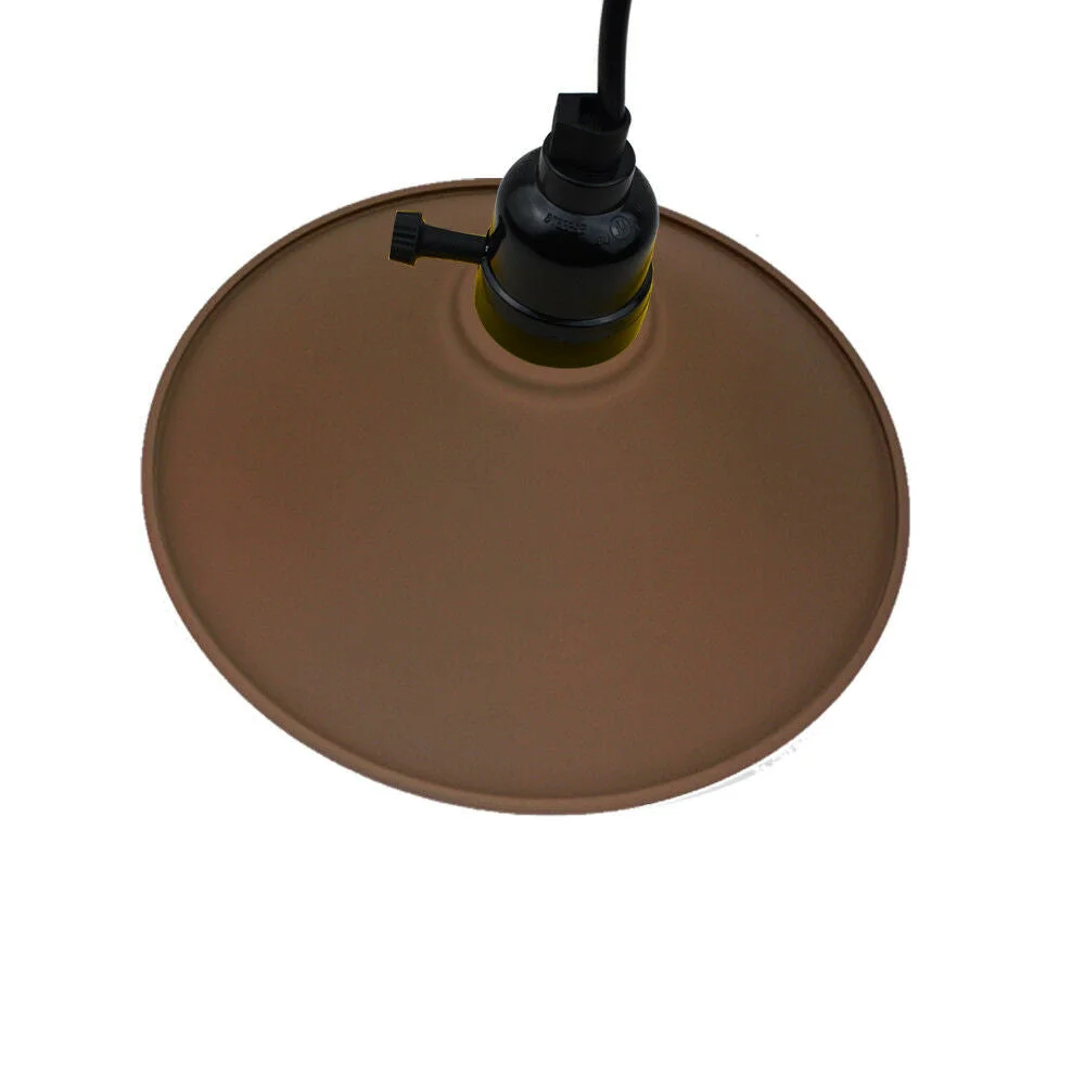 Vintage style ceiling light in brown shade with black fabric cable, pendant hanging from metal cradle.